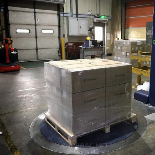 Cargo being re-palletized or re-crated for compliant transport